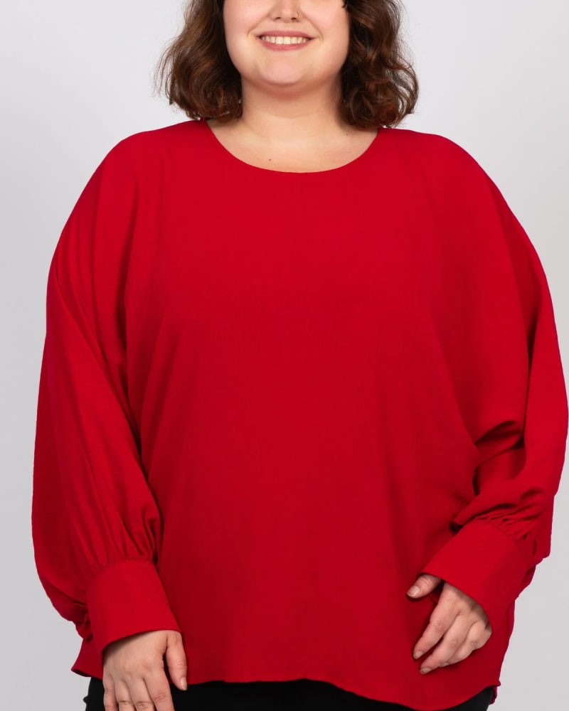 Front of a model wearing a size 1X Eloise Oversized Blouse Long Sleeves Solid in Red by ANNICK. | dia_product_style_image_id:315371